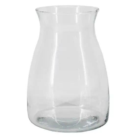 Jarrón de vidrio transparente con base ancha y cuello largo sobre superficie beige — Rosgaly Floristería Barcelona